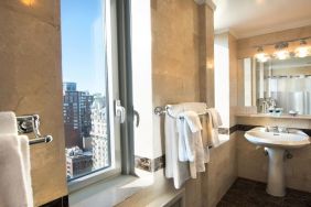 Private guest bathroom with shower at Beacon Hotel.