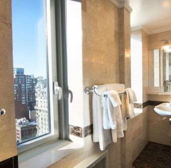 Private guest bathroom with shower at Beacon Hotel.