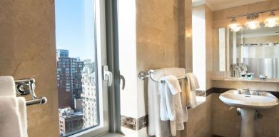 Private guest bathroom with shower at Beacon Hotel.