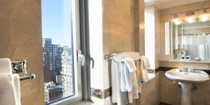 Private guest bathroom with shower at Beacon Hotel.