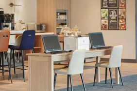 Business center with PC, internet, and printer at Hyatt Place London Heathrow Airport.