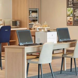 Business center with PC, internet, and printer at Hyatt Place London Heathrow Airport.