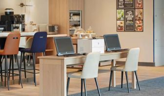 Business center with PC, internet, and printer at Hyatt Place London Heathrow Airport.