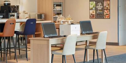 Business center with PC, internet, and printer at Hyatt Place London Heathrow Airport.