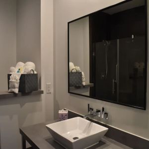 Private guest bathroom with shower at Hotel Bella.