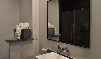 Private guest bathroom with shower at Hotel Bella.