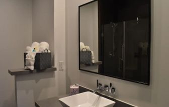 Private guest bathroom with shower at Hotel Bella.