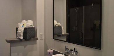 Private guest bathroom with shower at Hotel Bella.