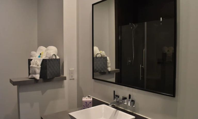 Private guest bathroom with shower at Hotel Bella.