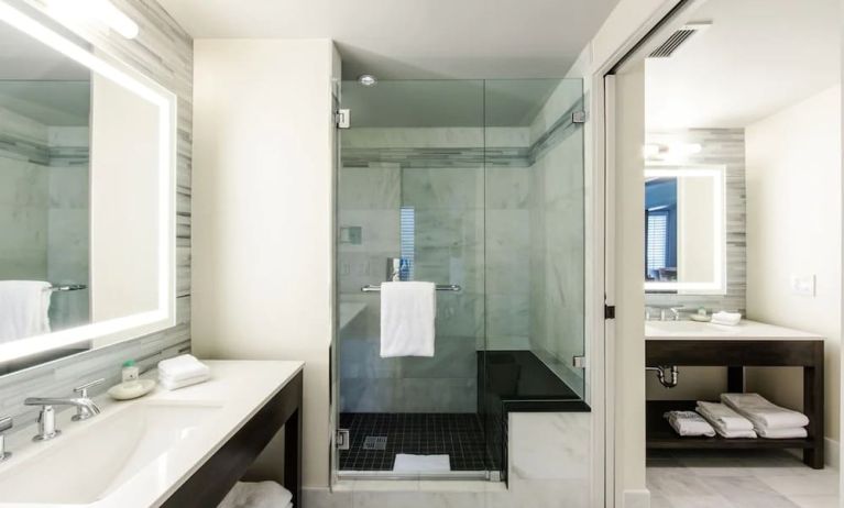 Private guest bathroom with shower at The Mosaic Hotel Beverly Hills.