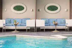 Relaxing pool area with comfortable seating at The Mosaic Hotel Beverly Hills.