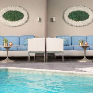 Relaxing pool area with comfortable seating at The Mosaic Hotel Beverly Hills.