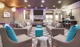 Lobby and coworking lounge at La Quinta Inn & Suites Cleveland Airport West.