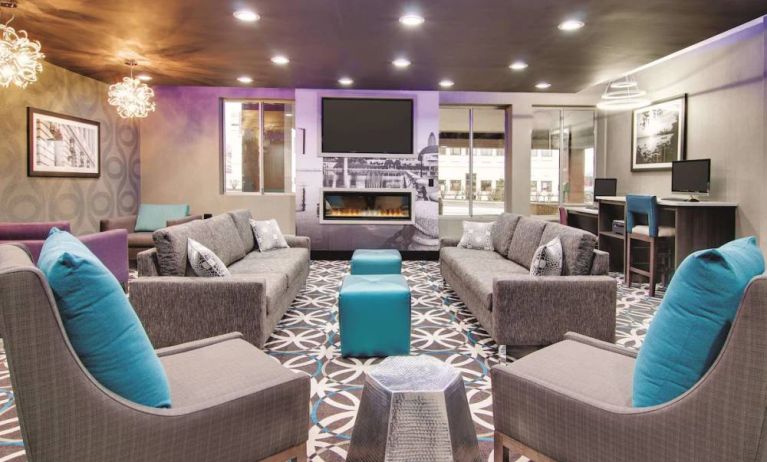 Lobby and coworking lounge at La Quinta Inn & Suites Cleveland Airport West.