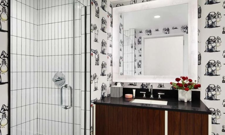 Private guest bathroom with shower at Graduate New York.