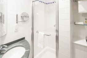 Private guest bathroom with shower at Hilton Garden Inn Bristol City Centre.