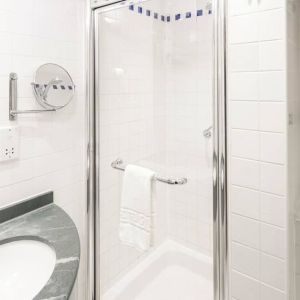 Private guest bathroom with shower at Hilton Garden Inn Bristol City Centre.