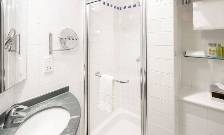 Private guest bathroom with shower at Hilton Garden Inn Bristol City Centre.