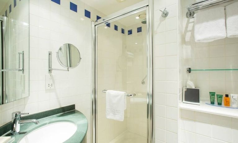 Private guest bathroom with shower at Hilton Garden Inn Glasgow City Centre.