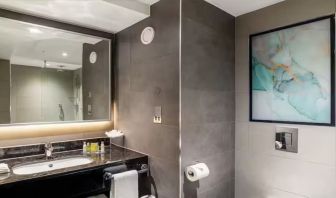 Private guest bathroom with shower at Hilton Garden Inn London Heathrow Terminals 2 And 3.