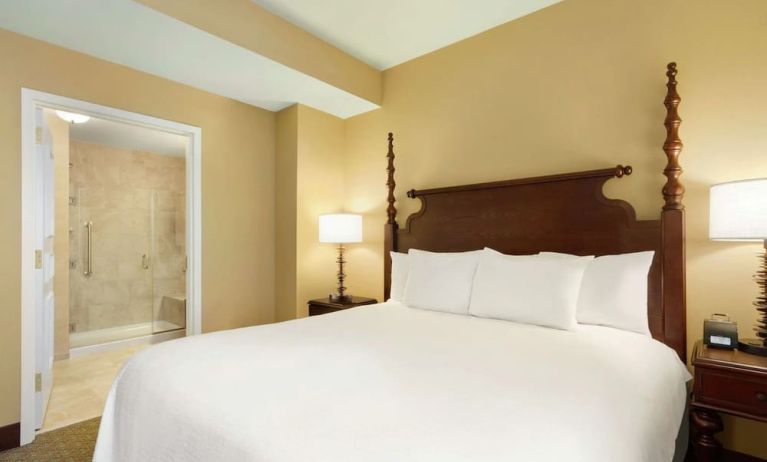 King bedroom with private bathroom at Embassy Suites By Hilton Savannah.