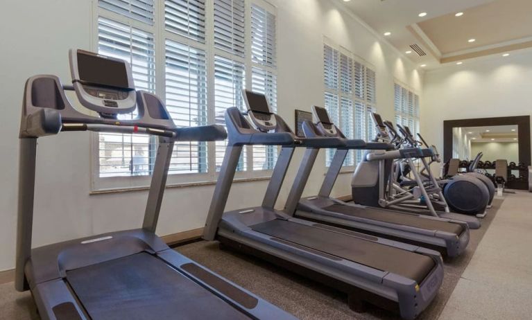 Well equipped fitness center at Embassy Suites By Hilton Savannah.