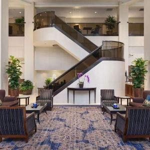 Lounge and coworking space at Embassy Suites By Hilton Santa Clara Silicon Valley.