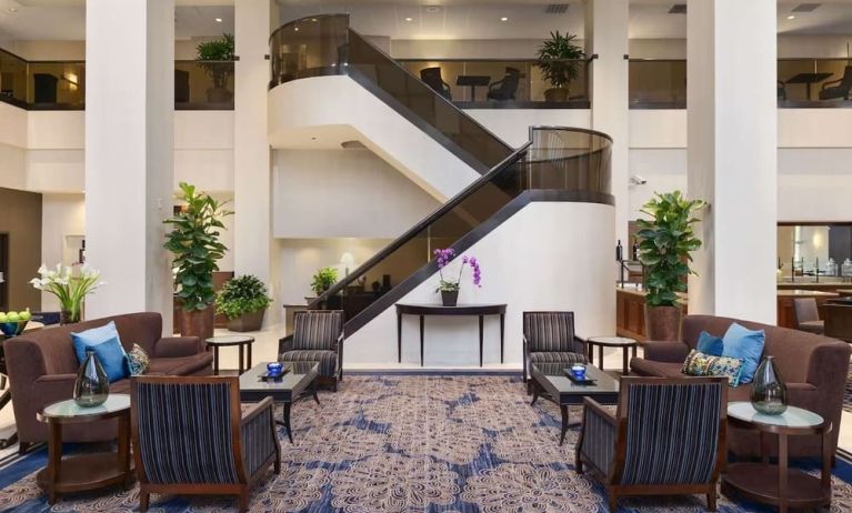 Lounge and coworking space at Embassy Suites By Hilton Santa Clara Silicon Valley.