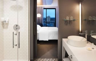 Private guest bathroom with shower at Le Méridien Columbus, The Joseph.