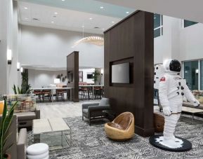 Lobby and coworking space at Hampton Inn & Suites Cape Canaveral Cruise Port.