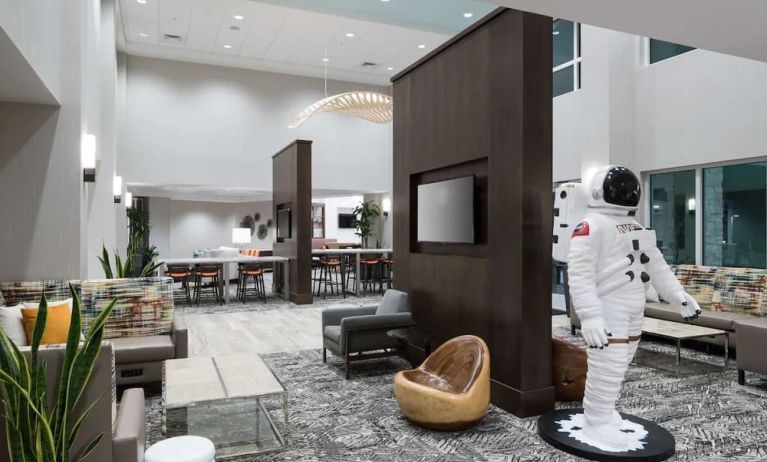 Lobby and coworking space at Hampton Inn & Suites Cape Canaveral Cruise Port.