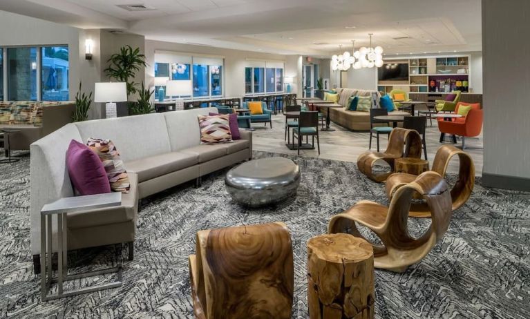 Lobby and coworking space at Home2 Suites By Hilton Cape Canaveral Cruise Port.