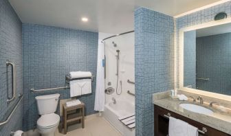 Guest bathroom with shower and tub at Homewood Suites By Hilton Miami Airport-Blue Lagoon.