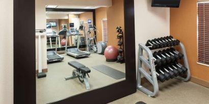 Fitness center at Homewood Suites By Hilton Miami Airport-Blue Lagoon.