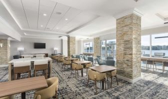 Lobby and coworking lounge at Homewood Suites By Hilton Miami Airport-Blue Lagoon.