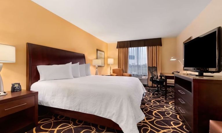 King bed with natural light at Hilton Garden Inn Shreveport Bossier City.