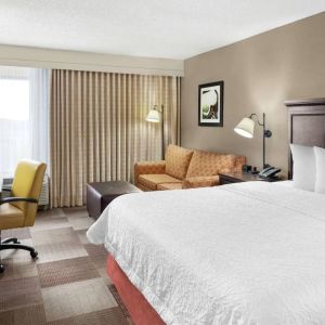 Day use room with work desk and sofa at Hampton Inn Dallas-Irving-Las Colinas.