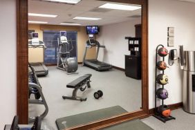 Well equipped fitness center at Homewood Suites By Hilton Denton.