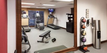 Well equipped fitness center at Homewood Suites By Hilton Denton.