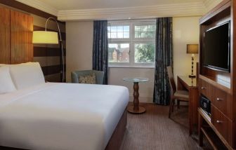 King bed with TV at DoubleTree By Hilton Stratford-upon-Avon.