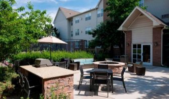 Fire pit and BBQ grill area at Residence Inn By Marriott Denver Highlands Ranch.