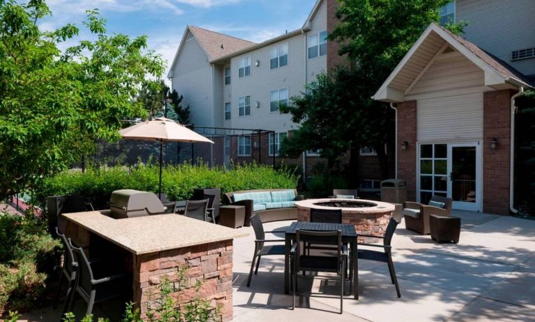 Fire pit and BBQ grill area at Residence Inn By Marriott Denver Highlands Ranch.