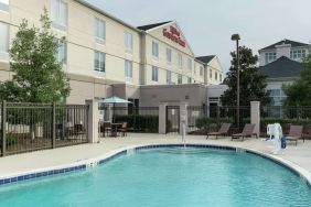 Stunning outdoor pool with pool chairs at Hilton Garden Inn Dothan.