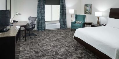 King bed with natural light at Hilton Garden Inn Dothan.