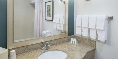 Guest bathroom with shower at Hilton Garden Inn Dothan.