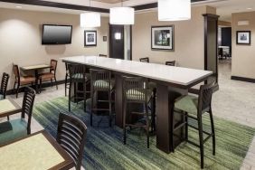 Dining and coworking space at Hampton Inn & Suites Gainesville-Downtown.