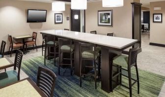 Dining and coworking space at Hampton Inn & Suites Gainesville-Downtown.