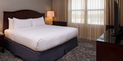 Delux king room with natural light at Hilton San Antonio Hill Country.