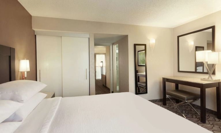 King bed with work space at Embassy Suites By Hilton Arcadia Pasadena Area.