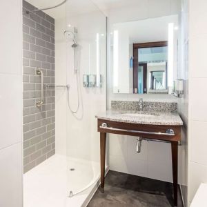 Guest bathroom with shower at Hampton By Hilton Humberside Airport.